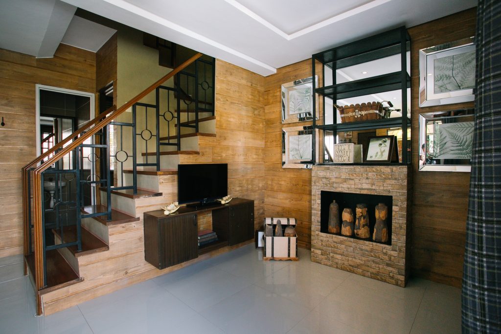 black flat screen tv on brown wooden tv rack